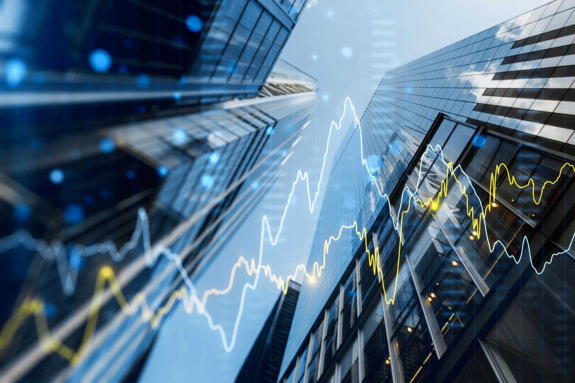office buildings with stock ticker line graph superimposed