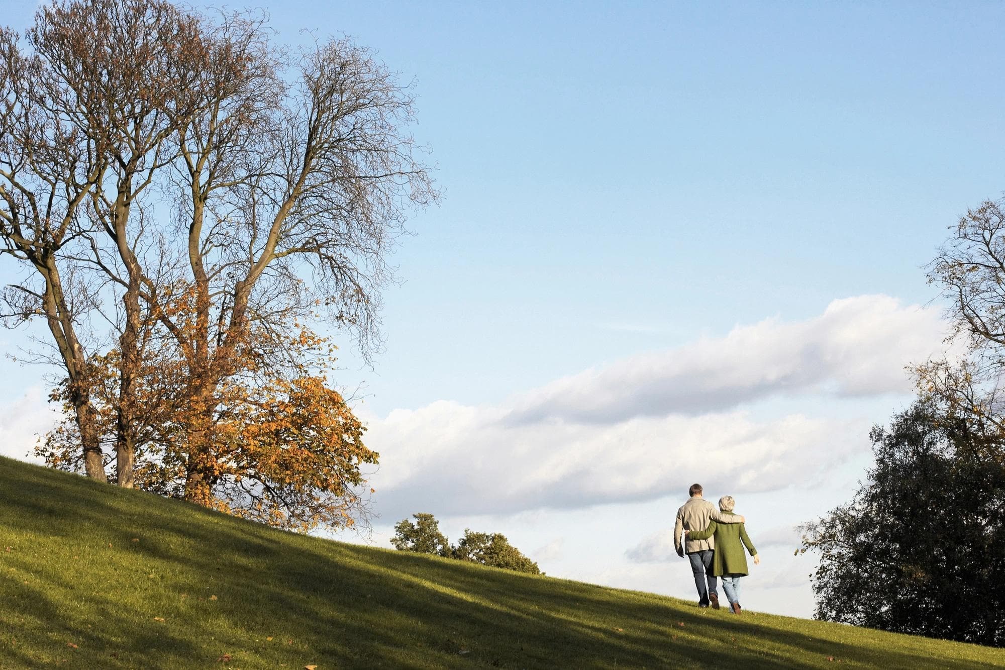 Couple walking on hill