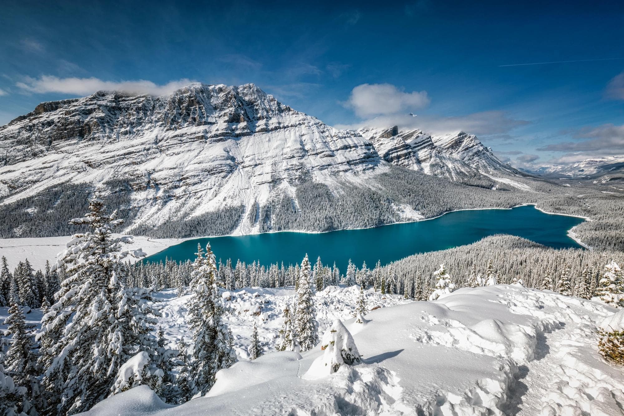 landscape of snowy mountains and lake