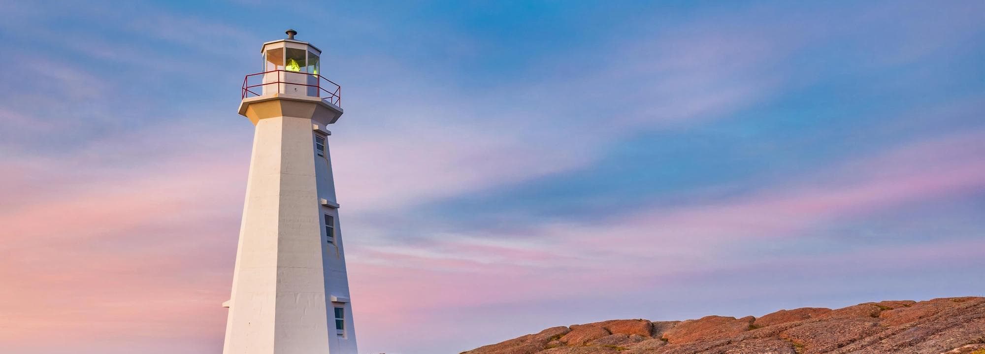 Lighthouse on the coast while the sun sets